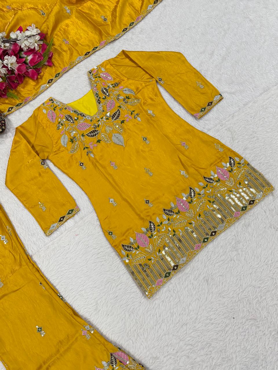 Elegant Rust Orange Silk Kurta and Flared Palazzo Set Adorned with Intricate Multicolored Botanical Embroidery and Mirror Work